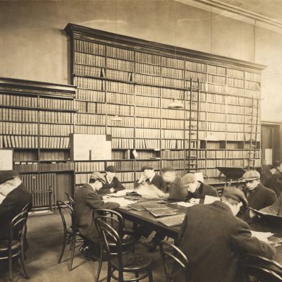 Type : Photograph Medium : Print-black-and-white Description : A view of the Central Library New Bridge Street Newcastle upon Tyne taken c.1910.  The photograph shows one of the rooms in the Central Library which has tall bookshelves along one wall.  Men are sitting reading at several long tables in the room.Libraries Collection : Local Studies Printed Copy : If you would like a printed copy of this image please contact Newcastle Libraries www.newcastle.gov.uk/tlt quoting Accession Number : 050143